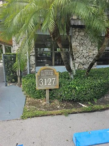 a sign broad on the side of the road