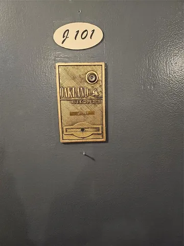 a bedroom with two beds and a window