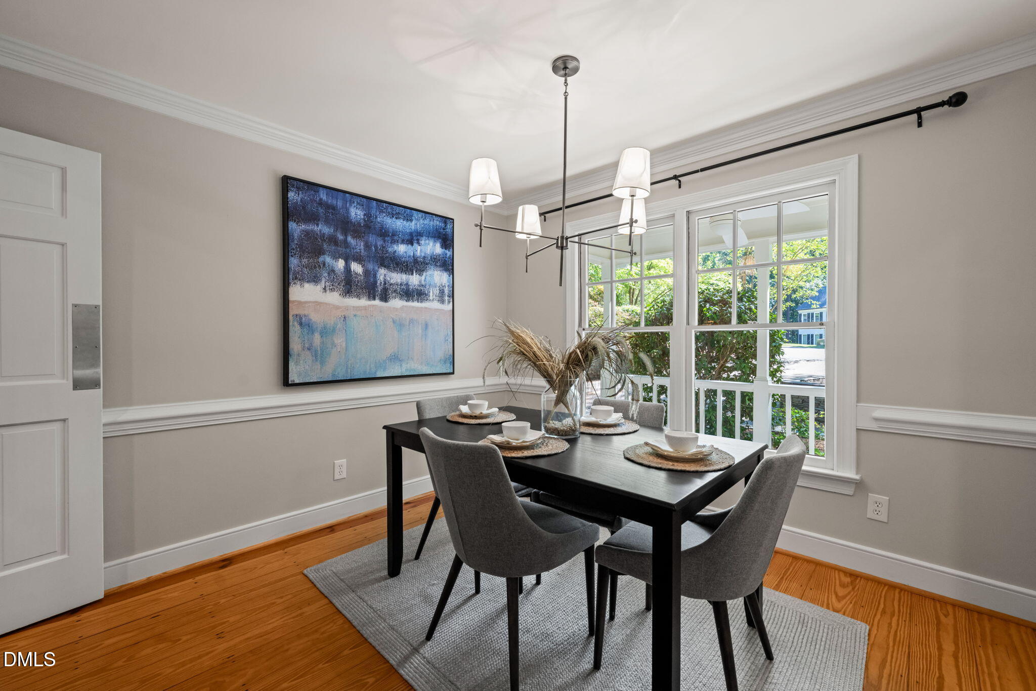 18 Strawberry Ridge Lane Durham, NC 27713 - Photo 24 of 59 a view of a dining room with furniture window and wooden floor