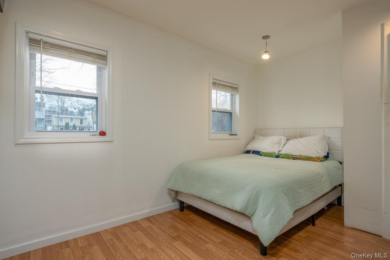 280 1st Street Newburgh, NY 12550 - Photo 14 of 24 a bedroom with a bed and window