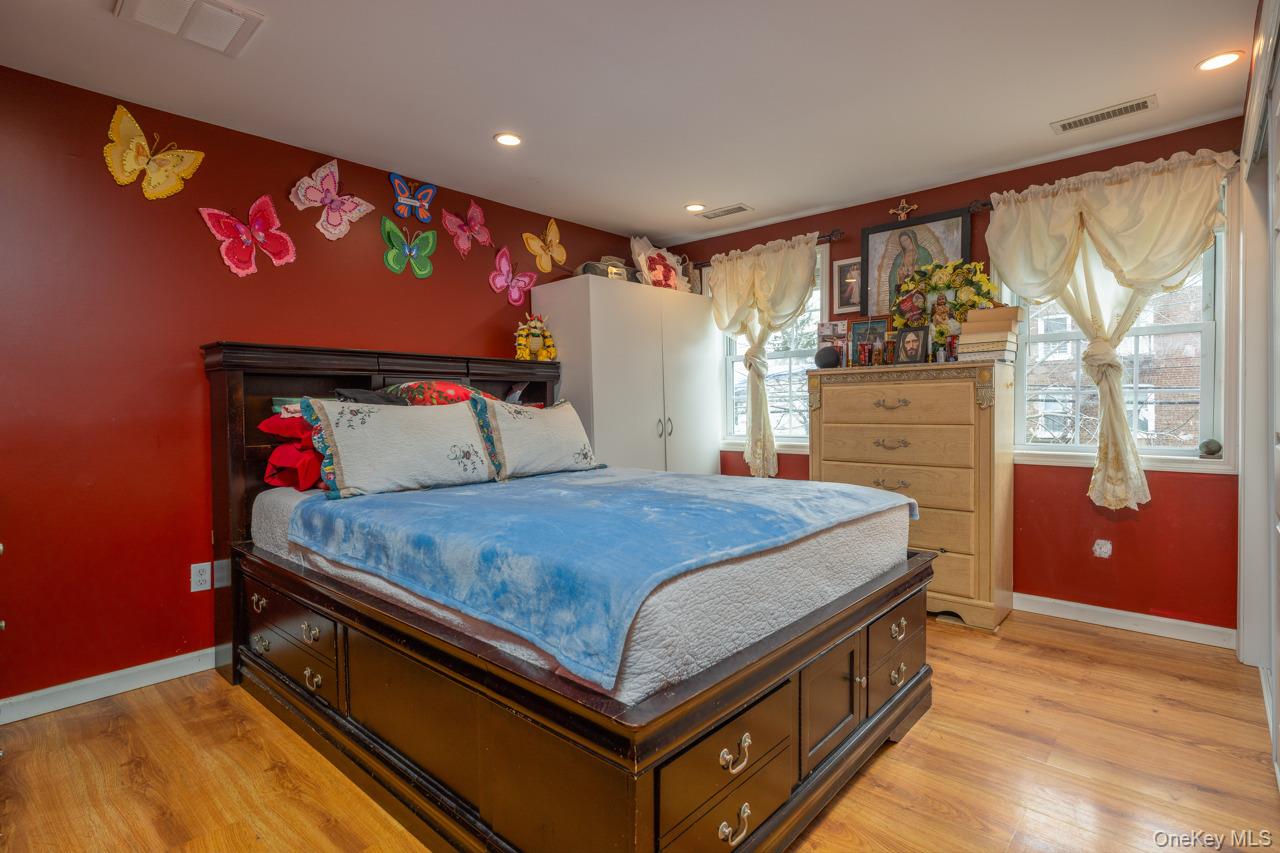 280 1st Street Newburgh, NY 12550 - Photo 18 of 24 a bed sitting in a room next to a window