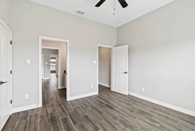 a view of a livingroom with wooden floor and closet
