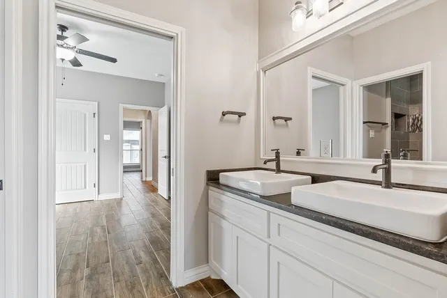 a bathroom with a sink and a mirror