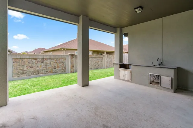 a view of a room with porch and a yard