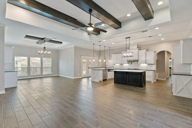 a view of kitchen with cabinets and wooden floor