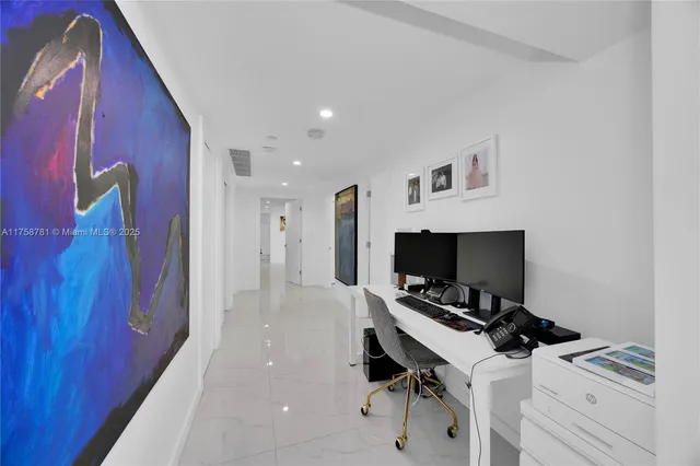 a room with furniture and a flat screen tv