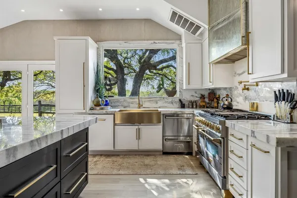 a bathroom with a sink a mirror and a shower