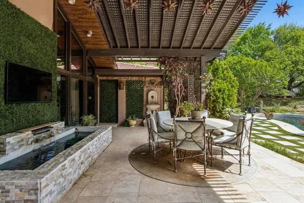 a view of a swimming pool with a patio