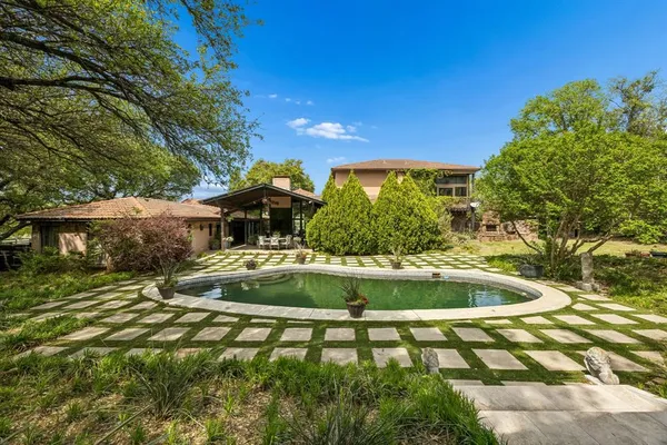 a view of a swimming pool with a patio