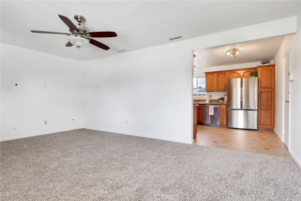 8955 Holly Lane Riverside, CA 92503 - Photo 8 of 32 a view of a kitchen with a sink and refrigerator