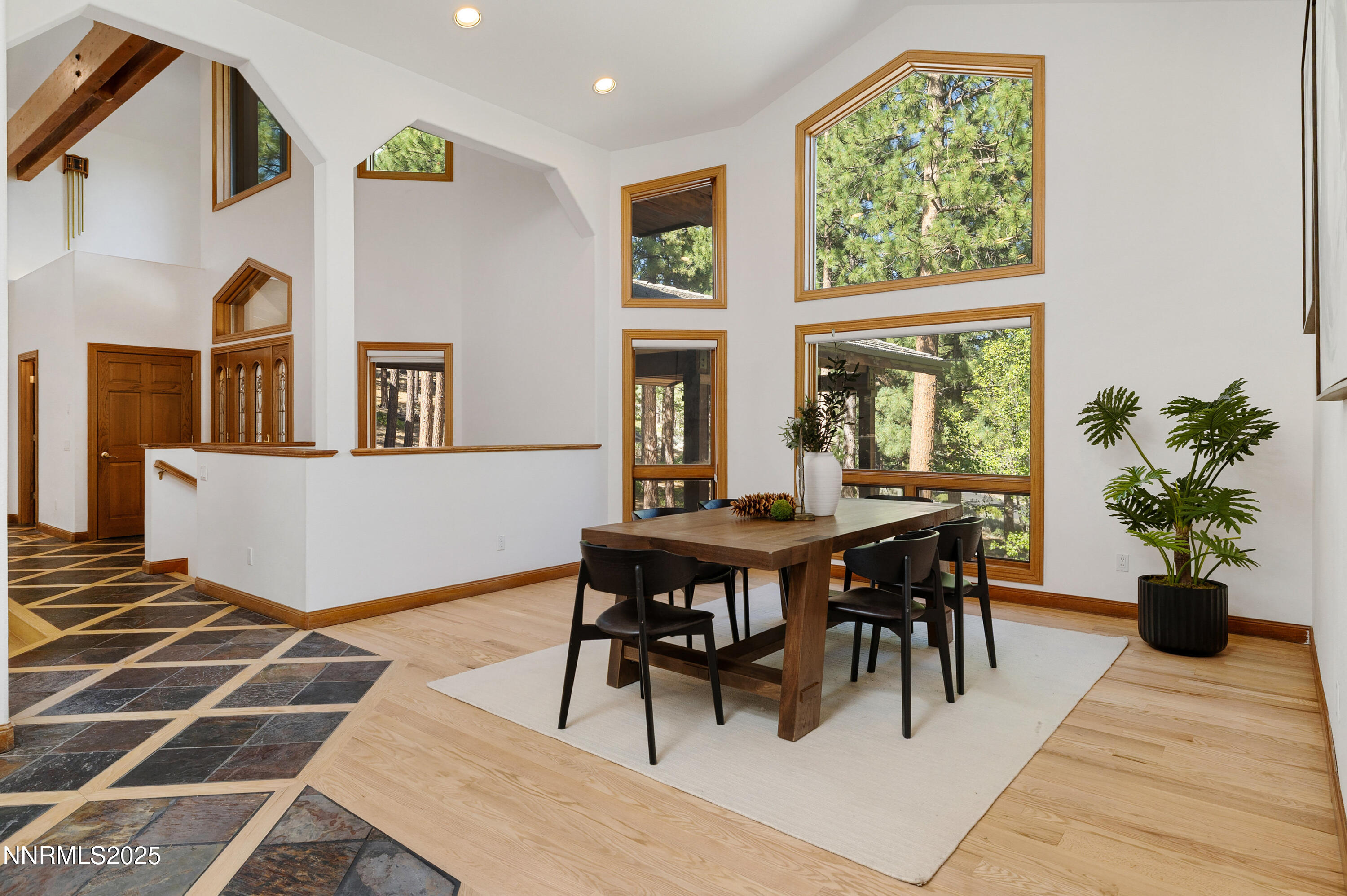 1745 Green Ash Drive Reno, NV 89511 - Photo 13 of 64 a view of a dining room with furniture and a potted plant