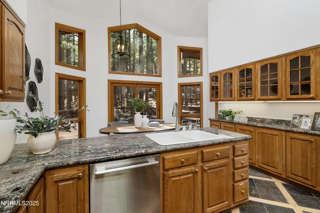 a kitchen with stainless steel appliances granite countertop a stove and a refrigerator
