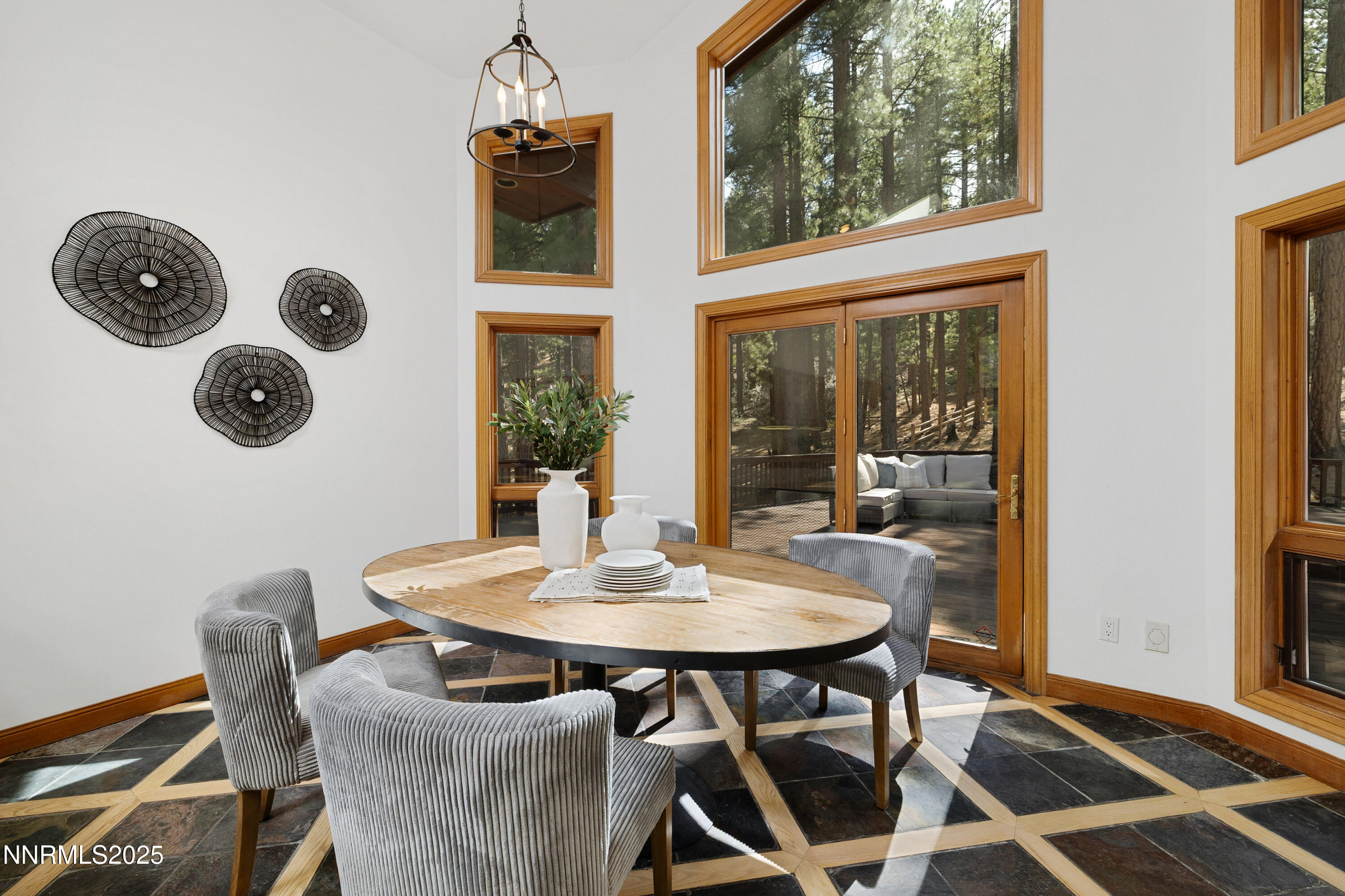 1745 Green Ash Drive Reno, NV 89511 - Photo 18 of 64 a view of a dining room with furniture and chandelier