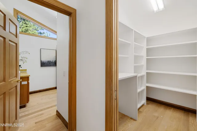 a spacious bedroom with a bed and couch