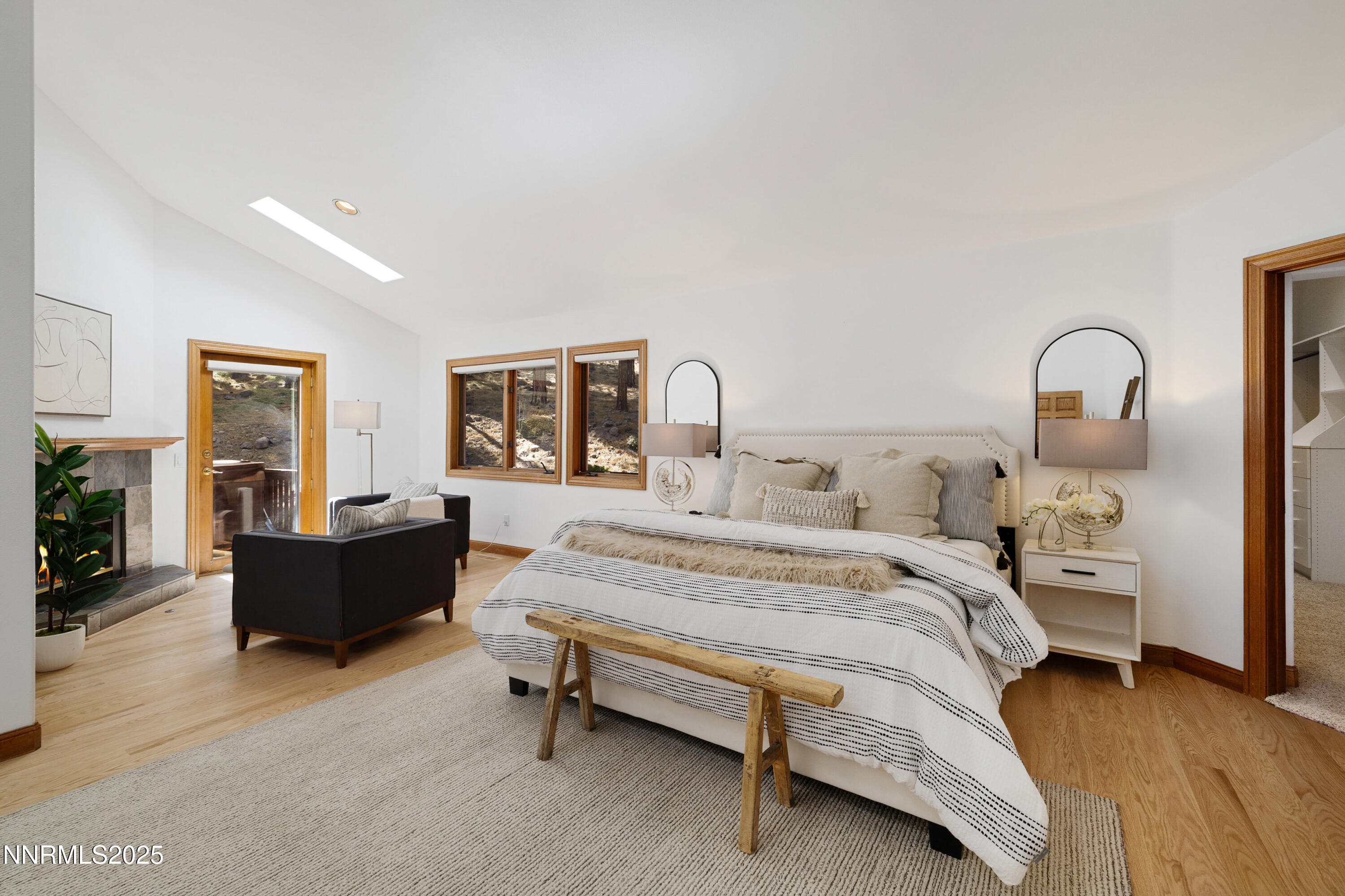 1745 Green Ash Drive Reno, NV 89511 - Photo 24 of 64 a spacious bedroom with a bed and couch