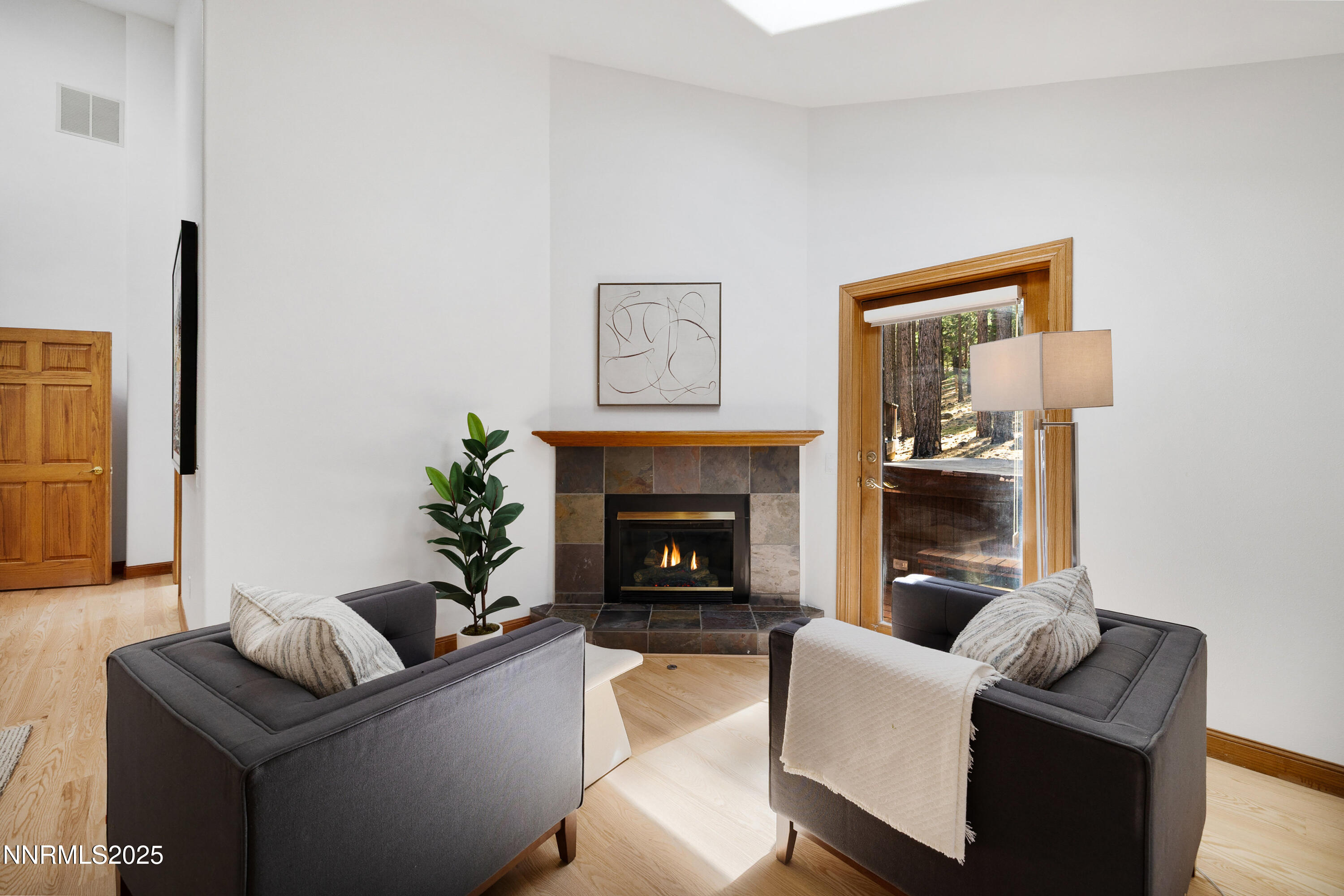 1745 Green Ash Drive Reno, NV 89511 - Photo 25 of 64 a living room with furniture and a fireplace