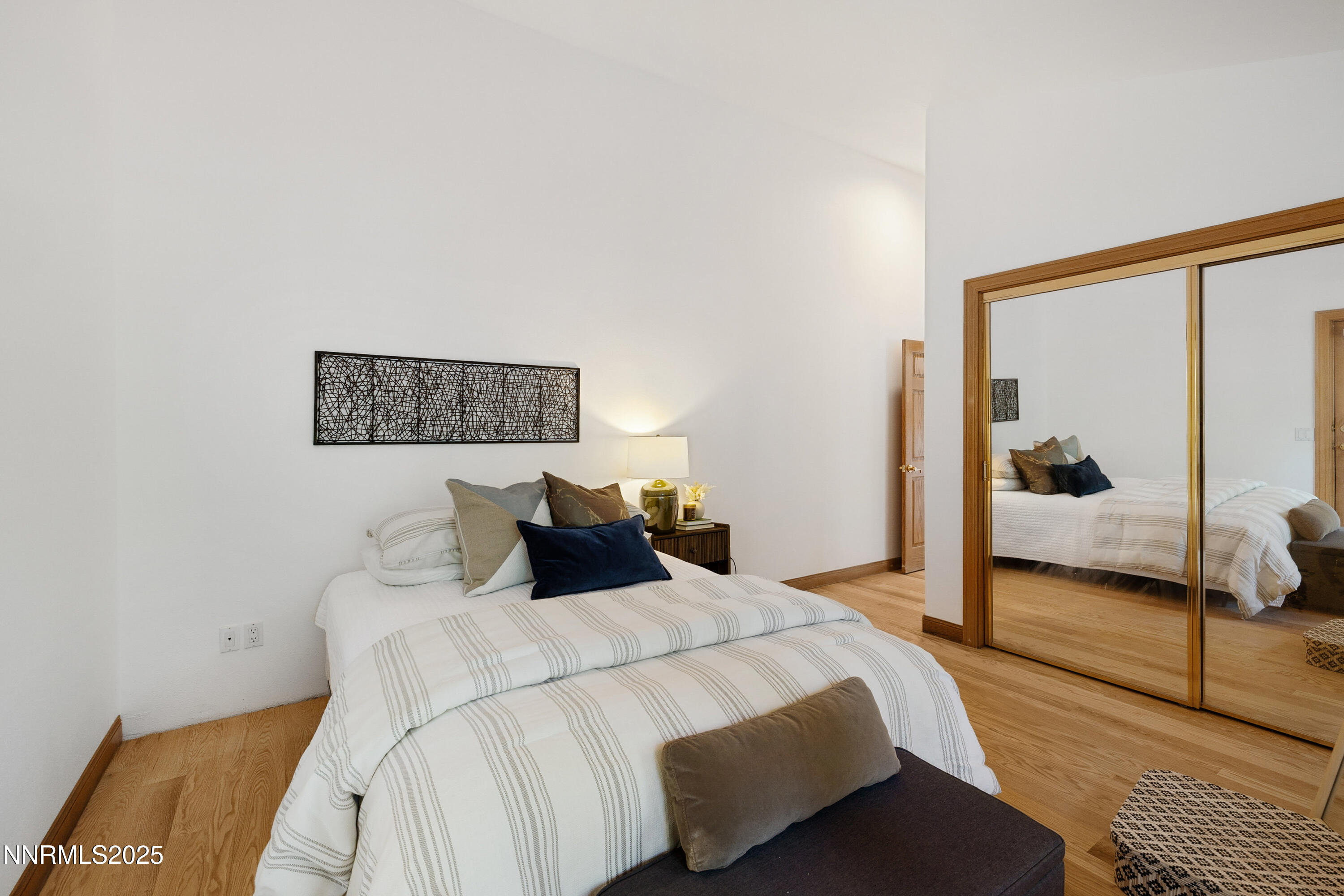 1745 Green Ash Drive Reno, NV 89511 - Photo 33 of 64 a bedroom with a bed and a potted plant