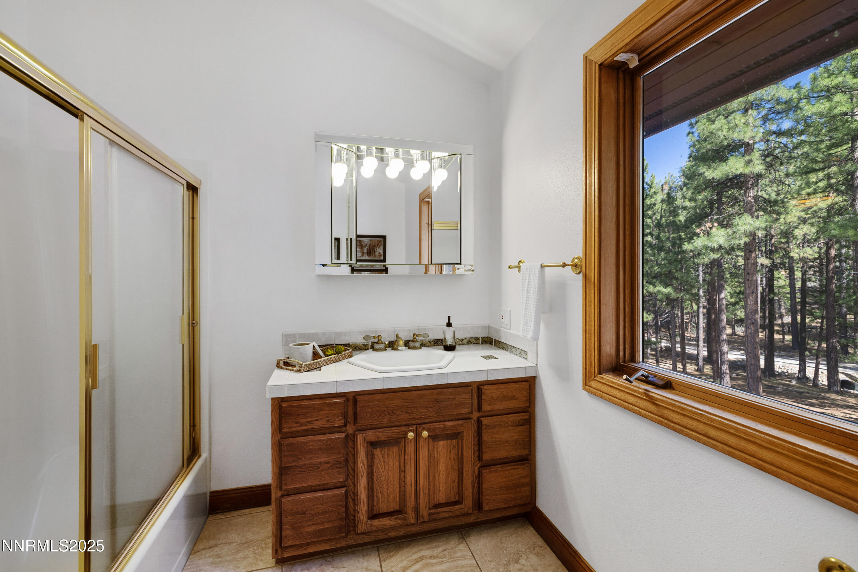 1745 Green Ash Drive Reno, NV 89511 - Photo 34 of 64 a bathroom with a double vanity sink and large mirror