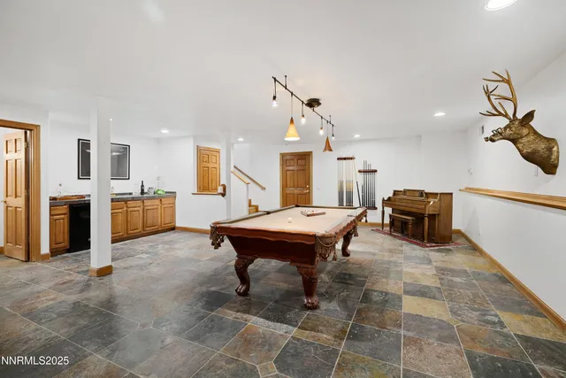 a bedroom with a bed and a chair