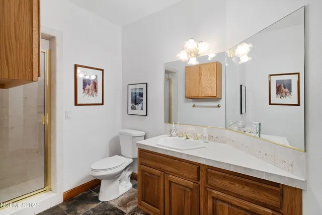 a view of a lush green hillside and a building