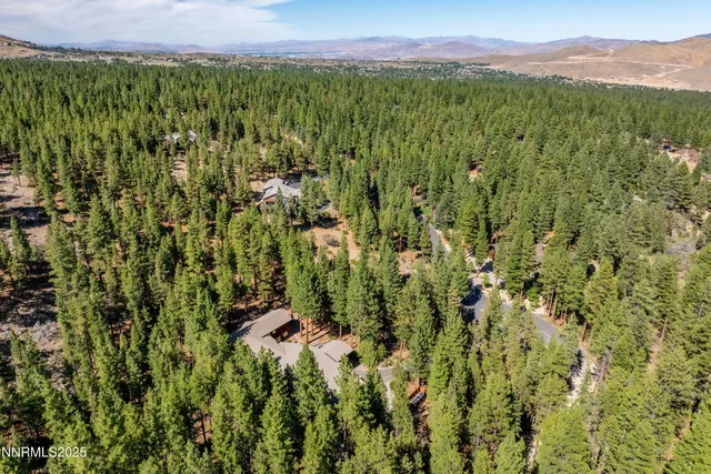 a view of a livingroom with a ceiling fan and window