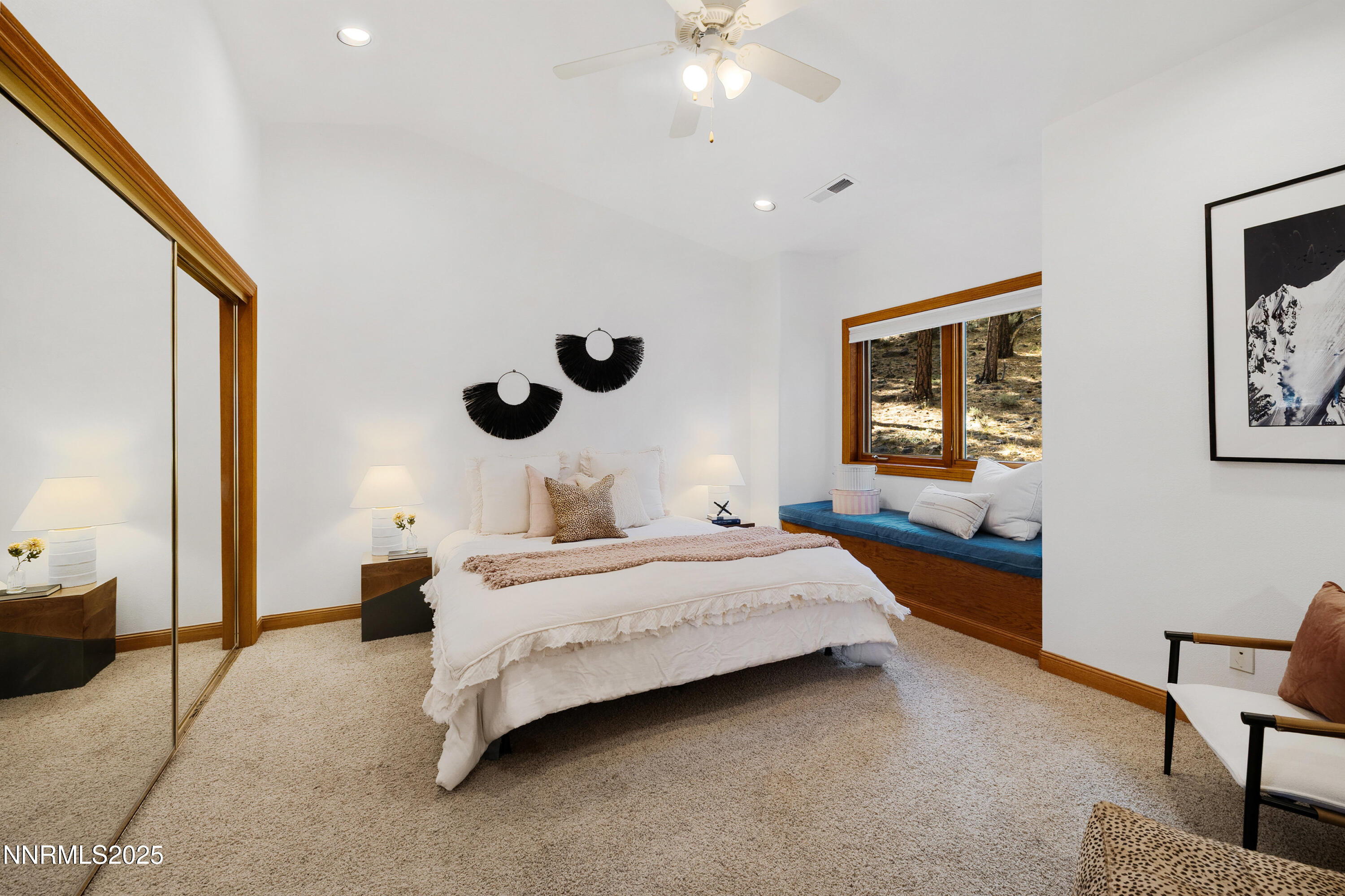 1745 Green Ash Drive Reno, NV 89511 - Photo 43 of 64 a bedroom with a bed and a chandelier