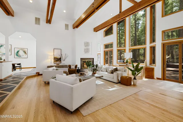 a view of a dining room with furniture and a potted plant