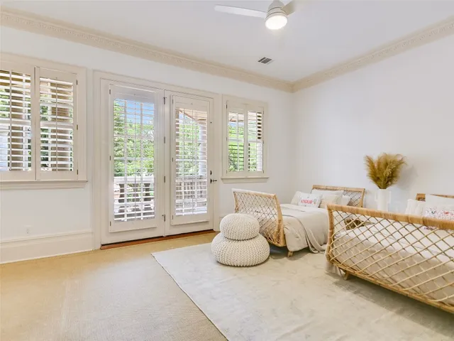 a spacious bedroom with a bed and a couch