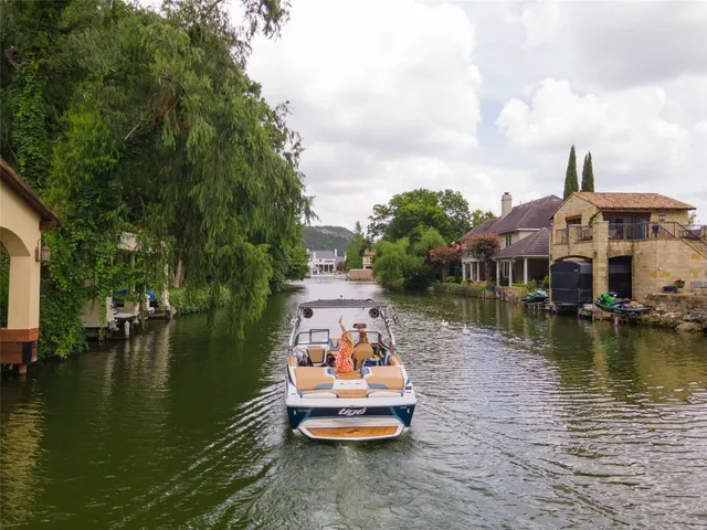 a swimming pool view with a lake view