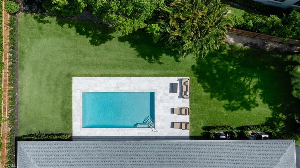 an outdoor space with seating area and garden