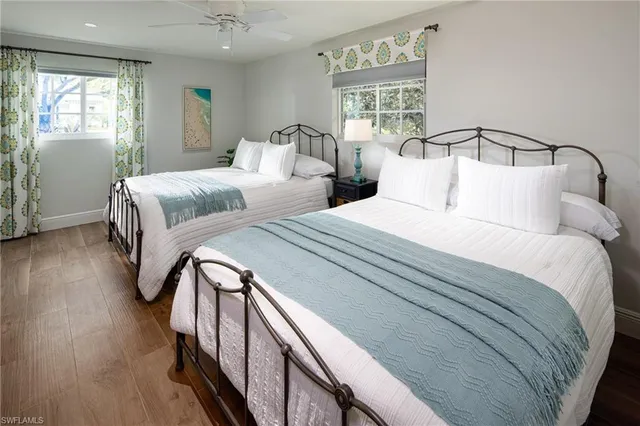 a bedroom with double bed and a window