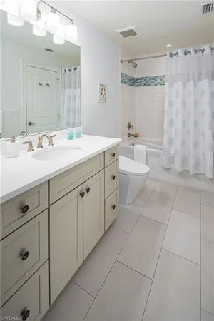 a spacious bathroom with a double vanity sink mirror and
