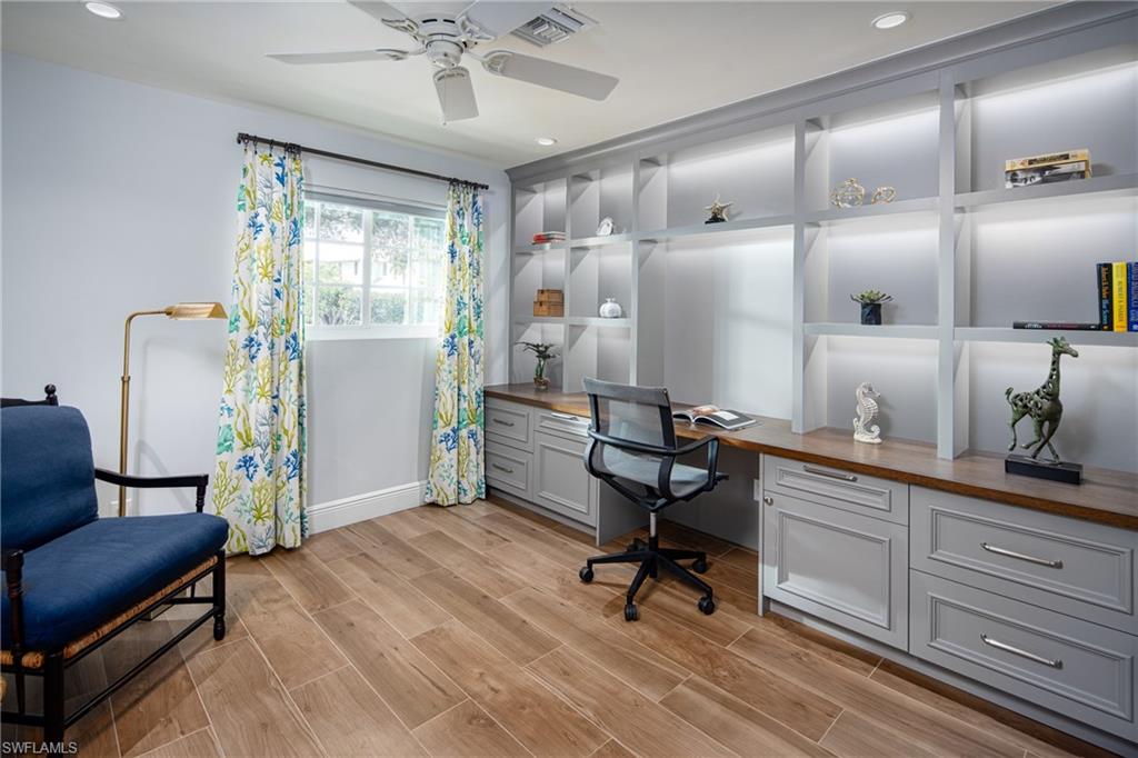 675 Yucca Road Naples, FL 34102 - Photo 14 of 24 a view of a livingroom with furniture and a window