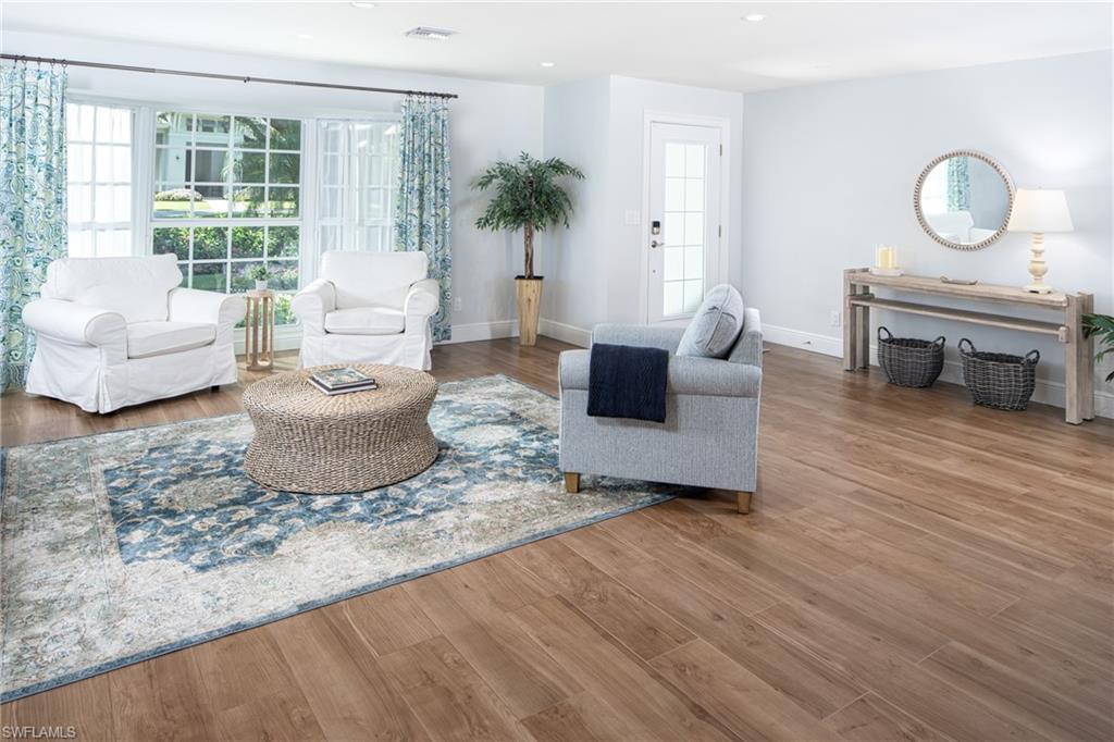 675 Yucca Road Naples, FL 34102 - Photo 7 of 24 a living room with furniture and a potted plant