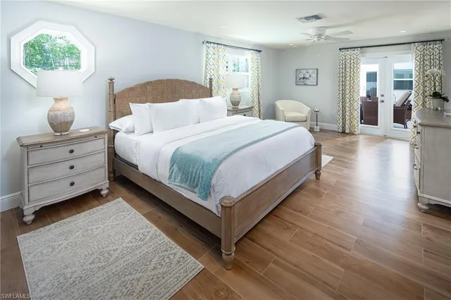 a bedroom with bed and window