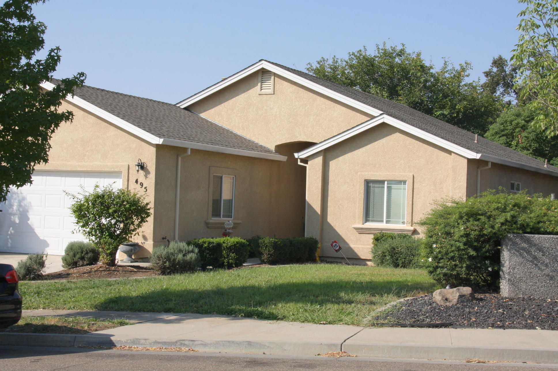 495 Springtime Lane Red Bluff, CA 96080 - Photo 2 of 20 a front view of a house with garden