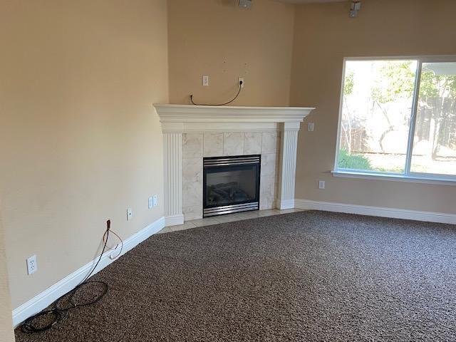 495 Springtime Lane Red Bluff, CA 96080 - Photo 5 of 20 an empty room with a fireplace and windows