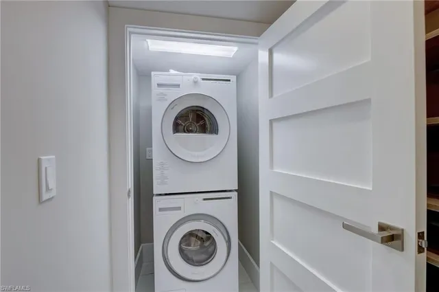 a bedroom with a bed and glass window