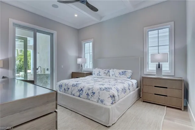 a bedroom with a bed and a table