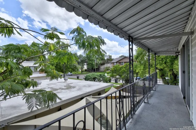a view of a porch with wooden floor