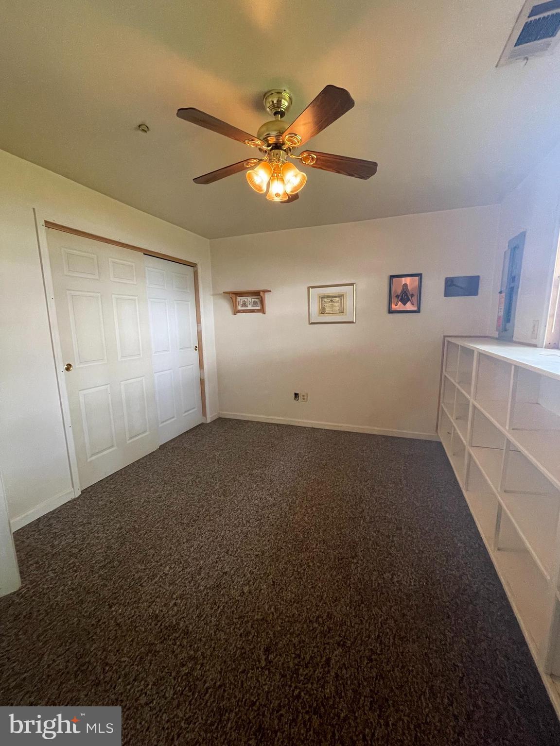 6223 Cliffside Terrace Frederick, MD 21701 - Photo 16 of 18 a view of a livingroom with a ceiling fan and window