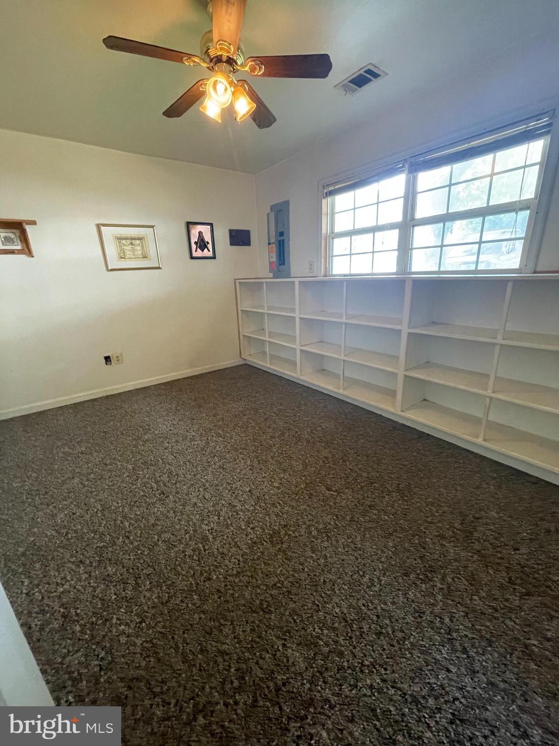 6223 Cliffside Terrace Frederick, MD 21701 - Photo 17 of 18 an empty room with windows and ceiling fan