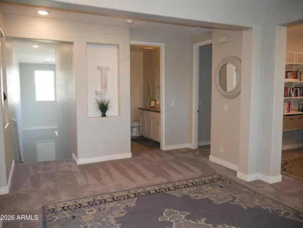 wooden floor with a bathroom