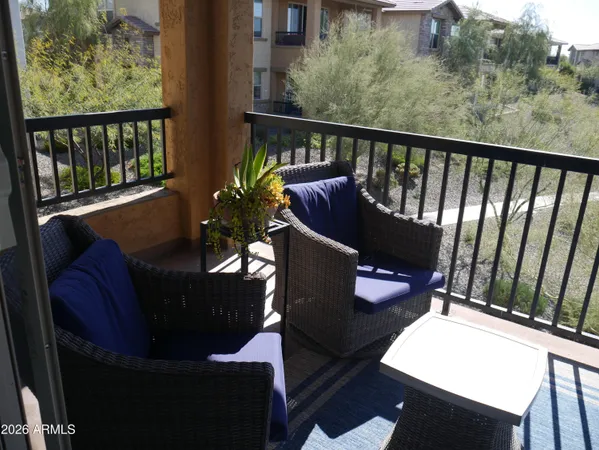 a view of balcony with furniture