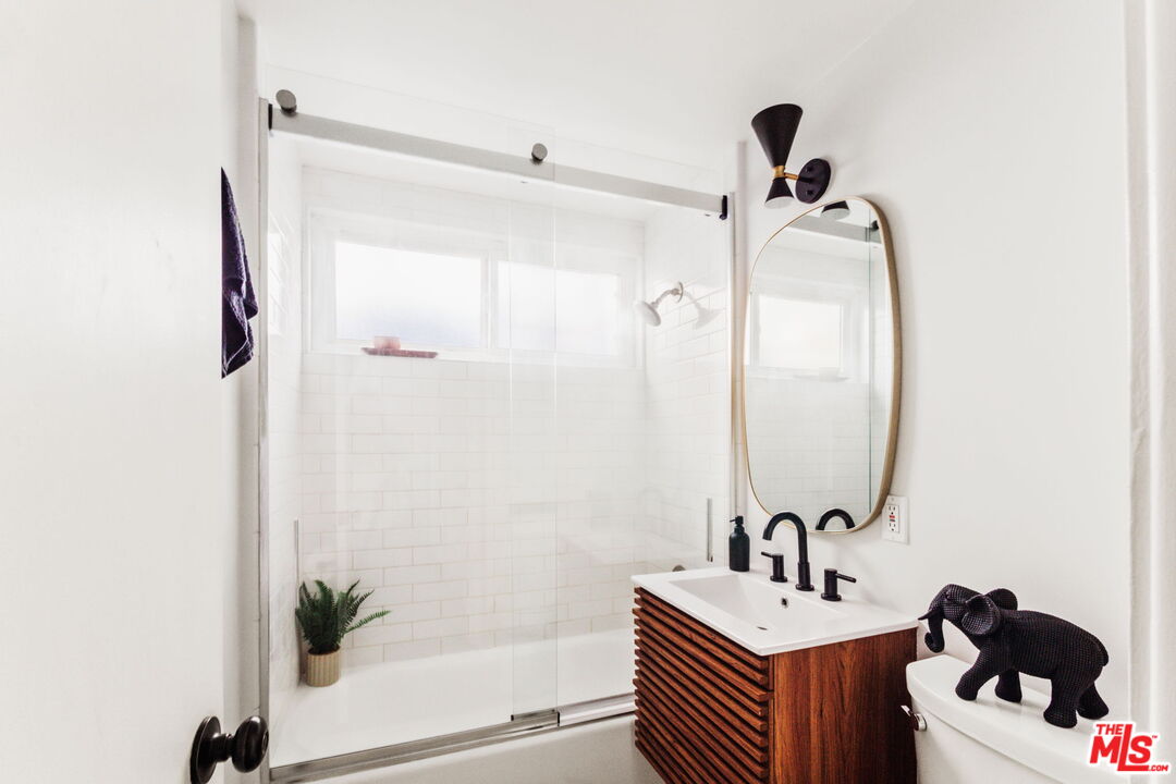 7606 Valmont Street Tujunga, CA 91042 - Photo 12 of 24 a bathroom with a sink toilet and shower
