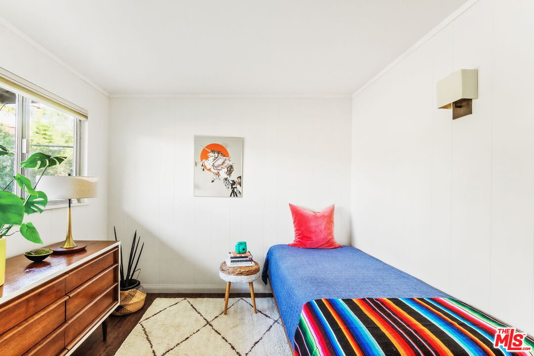 7606 Valmont Street Tujunga, CA 91042 - Photo 14 of 24 a living room with a couch and a potted plant