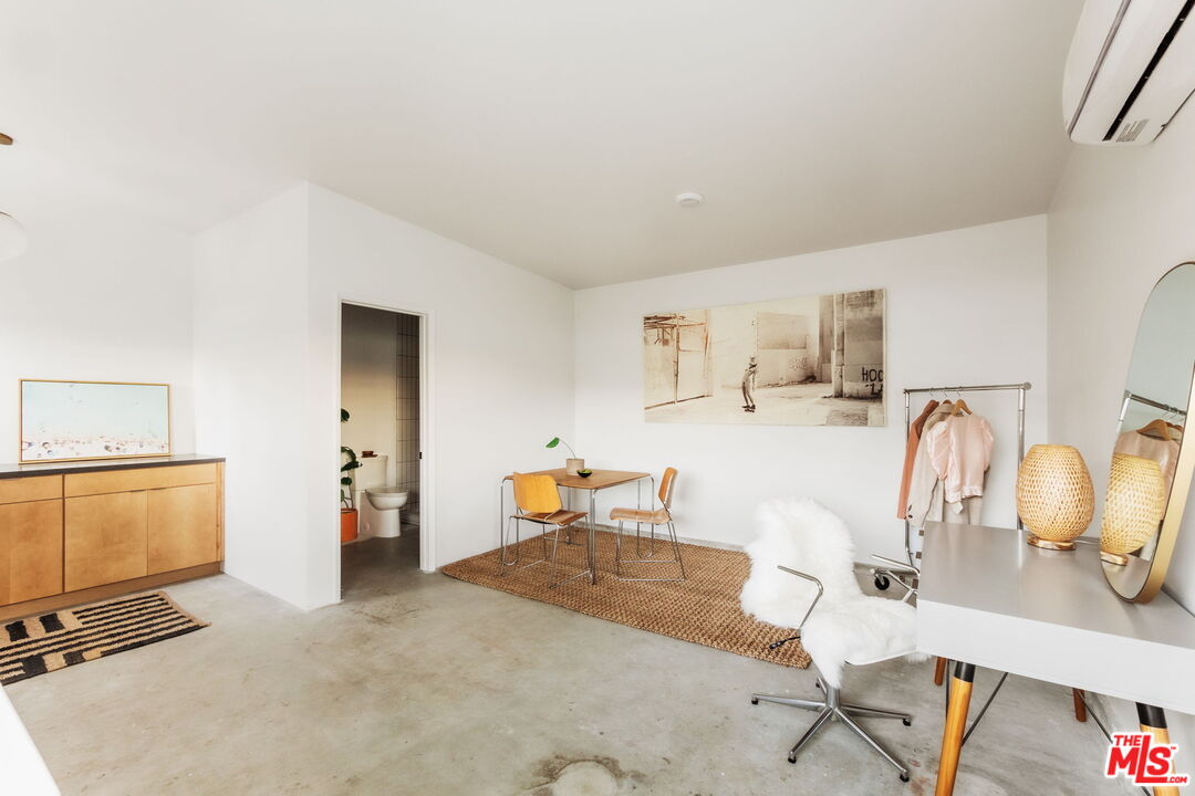 7606 Valmont Street Tujunga, CA 91042 - Photo 15 of 24 a dining room with furniture a window and gym equipment