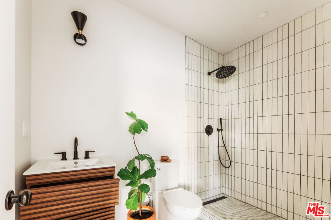 7606 Valmont Street Tujunga, CA 91042 - Photo 18 of 24 a bathroom with a shower