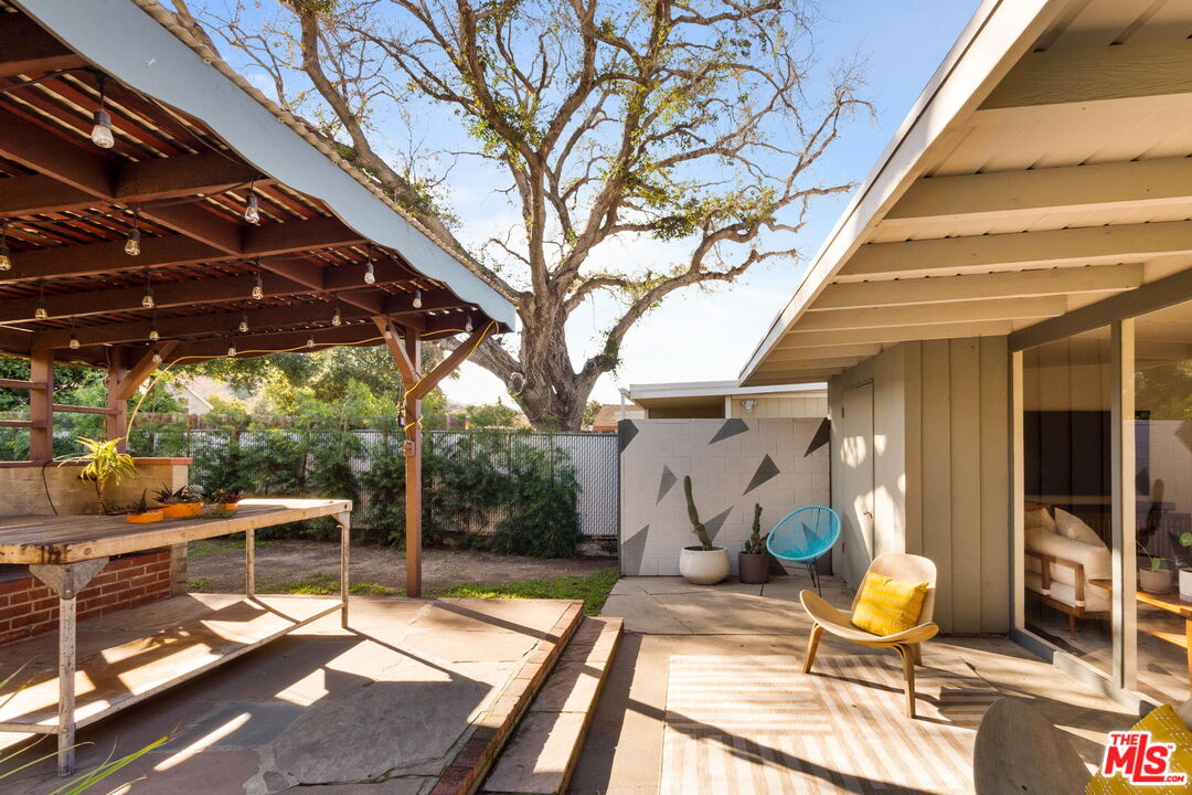 7606 Valmont Street Tujunga, CA 91042 - Photo 21 of 24 a view of a chairs and table in the patio