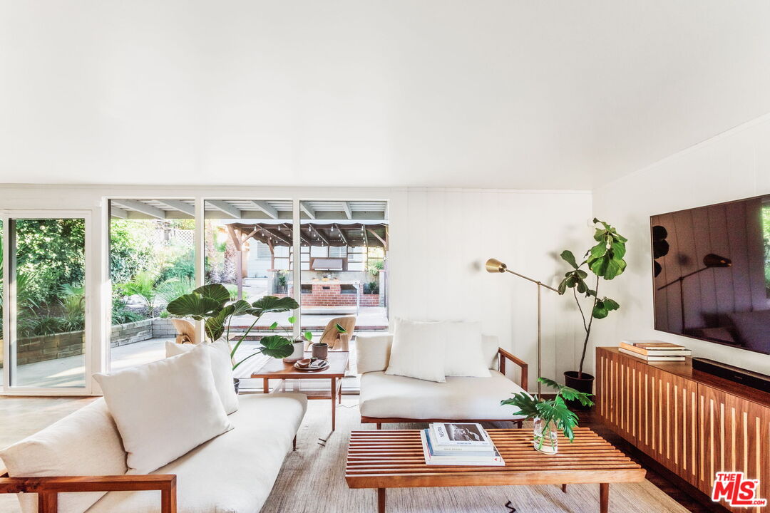 7606 Valmont Street Tujunga, CA 91042 - Photo 4 of 24 a living room with furniture and a potted plant